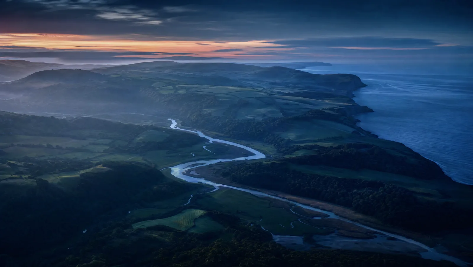 South of England countryside and coastline at dusk