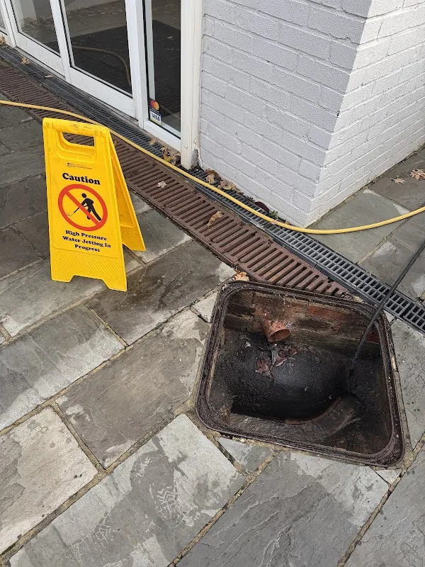 High-pressure water jetting in progress on a blocked drain